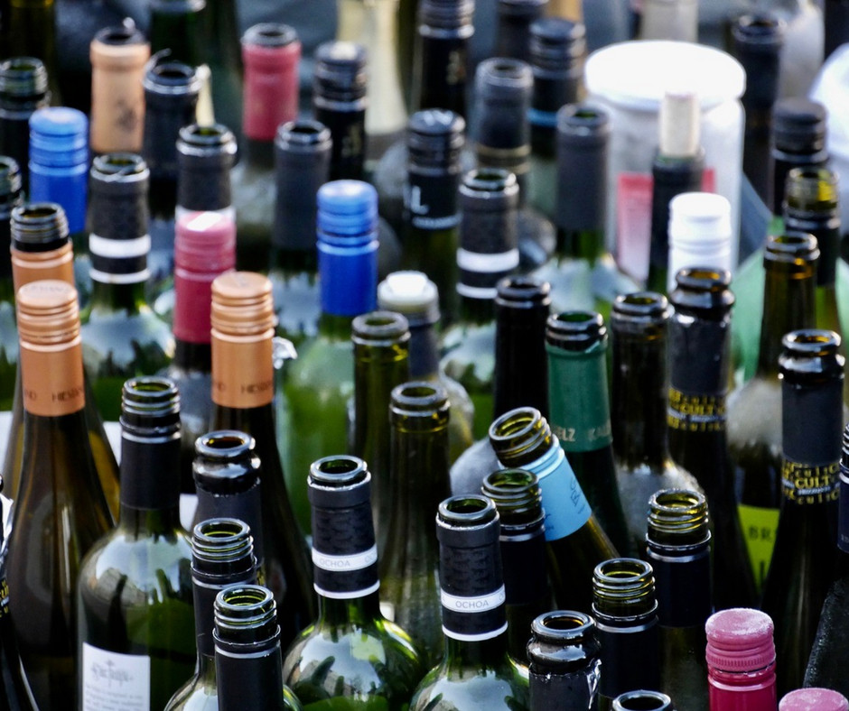 many empty glass bottles of wine